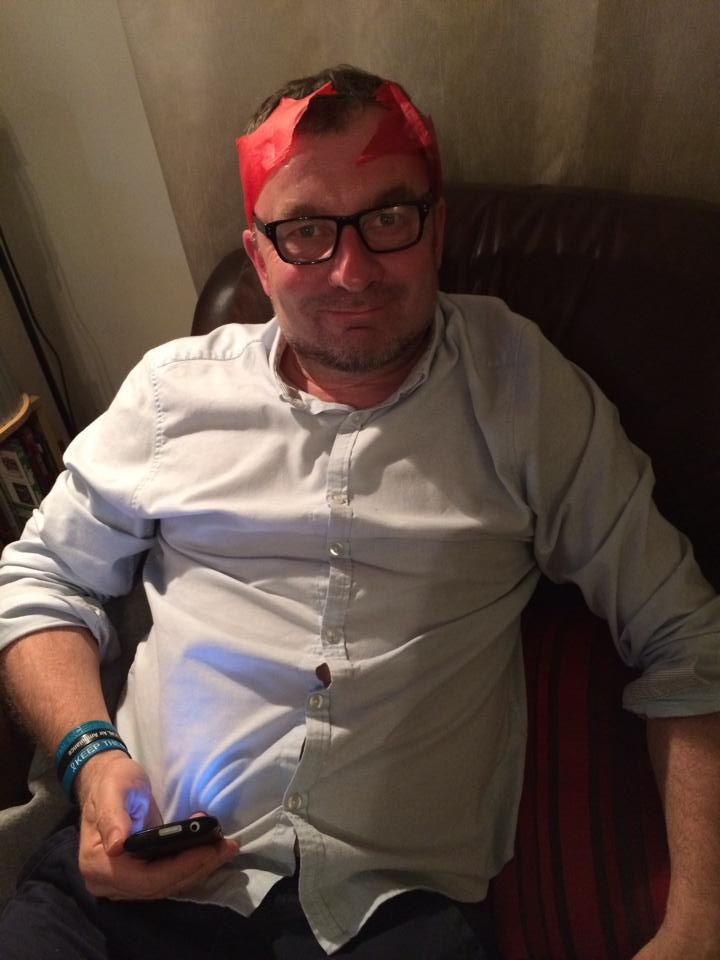 dad wearing a christmas cracker hat