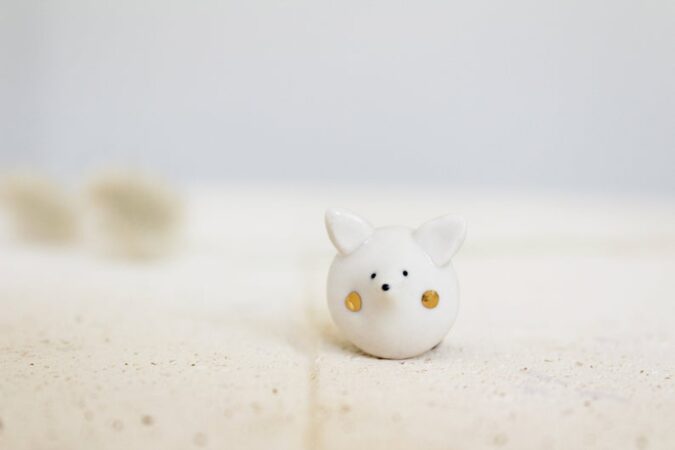 Ceramic snow fox pin badge from Katy Pillinger